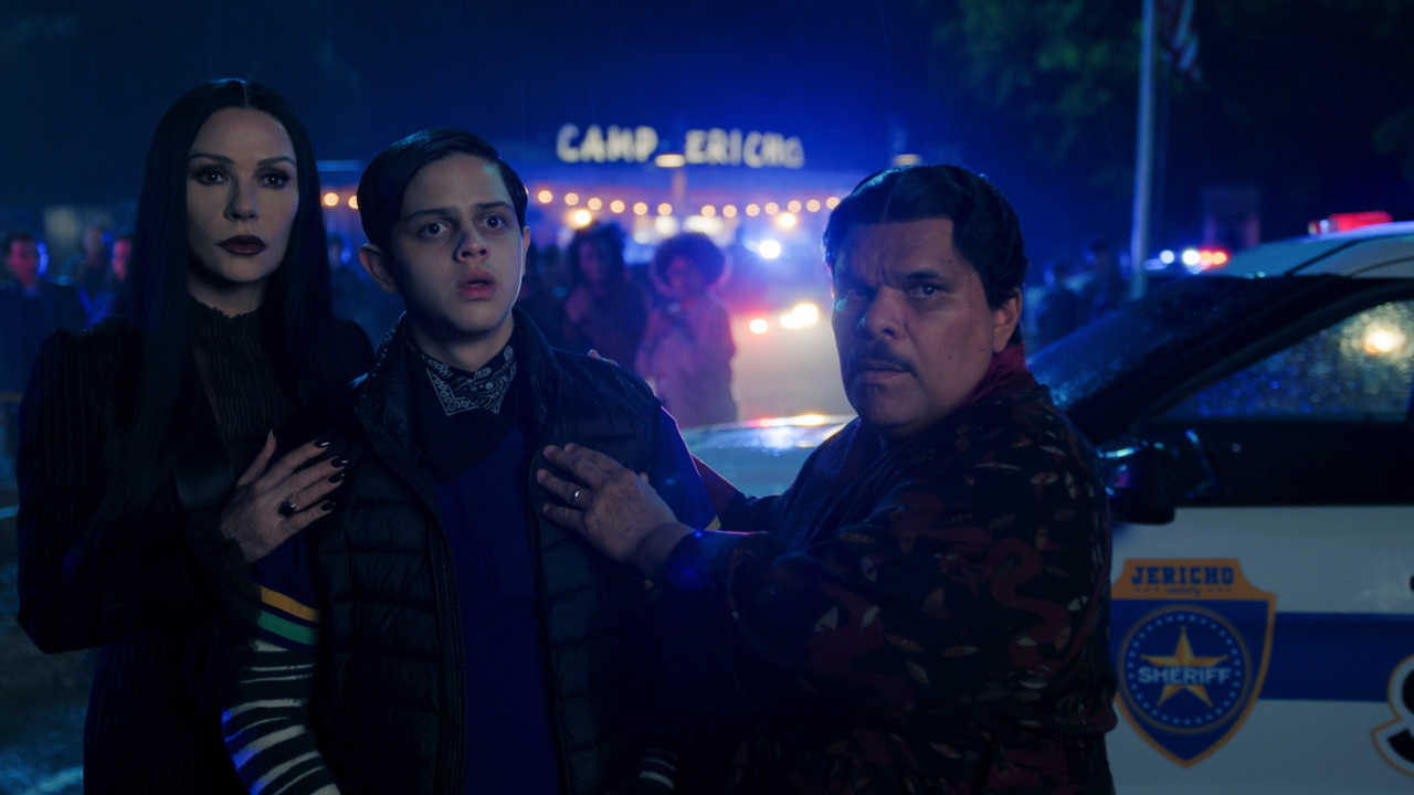 (L to R) Catherine Zeta-Jones as Morticia Addams, Isaac Ordonez as Pugsley Addams, Luis Guzmán as Gomez Addams in episode 203 of ‘Wednesday’ Season 2. Photo: Courtesy of Netflix © 2025.